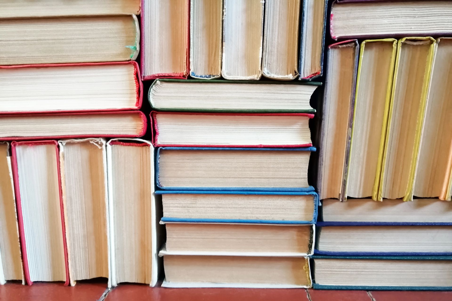 A stack of printed hardcover books at a printing shop in Dayton, OH